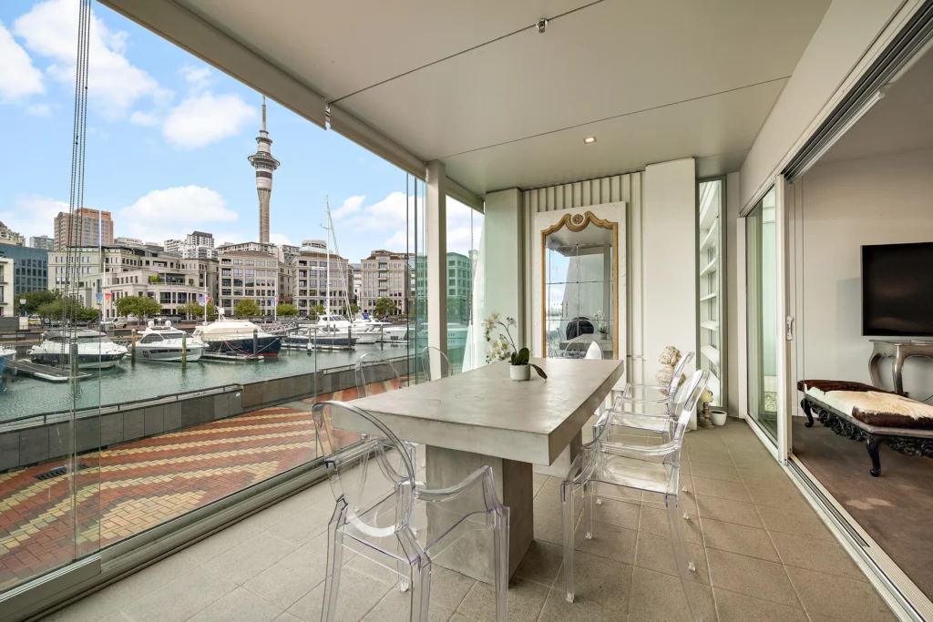 Luxury waterfront apartment terrace overlooking the Auckland Viaduct and Sky Tower